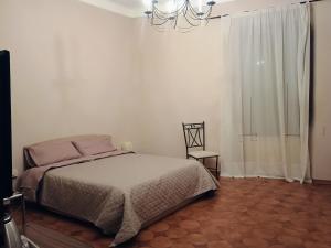 Postel nebo postele na pokoji v ubytování La Divina guest house