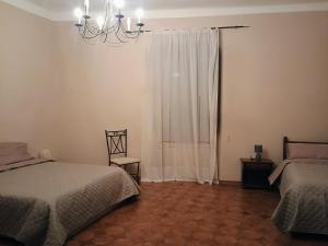 Postel nebo postele na pokoji v ubytování La Divina guest house