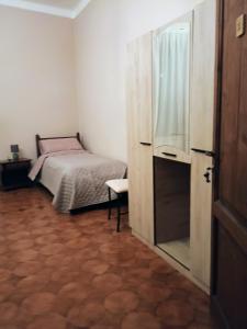 Postel nebo postele na pokoji v ubytování La Divina guest house