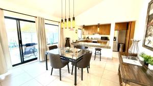 a kitchen and dining room with a table and chairs at Ajijic San Antonio Lake Chapala Villas - Pickleball Court - Gym in San Antonio