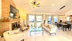 a living room with a couch and a fireplace at Ajijic San Antonio Lake Chapala Villas - Pickleball Court - Gym in San Antonio +85 photos