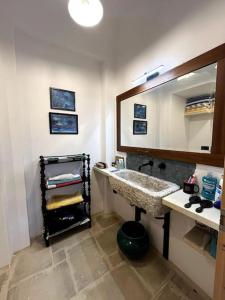 a bathroom with a sink and a mirror at Villa Da Mimmo a 350 mt dal mare in Campomarino