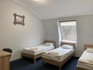 Postel nebo postele na pokoji v ubytování Budget Hotel Ekotel