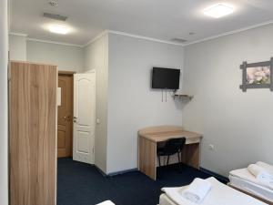 TV a/nebo společenská místnost v ubytování Budget Hotel Ekotel