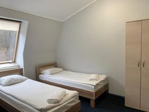 Postel nebo postele na pokoji v ubytování Budget Hotel Ekotel