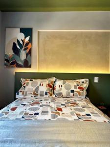 Una cama o camas en una habitación de Lindo Studio Vila Pauliceia Santana Zona Norte