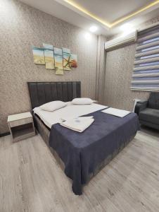 Postel nebo postele na pokoji v ubytování Gemi Hotel + 5 fotografií