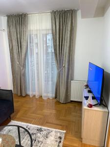 TV a/nebo společenská místnost v ubytování Apartment Infinity 2