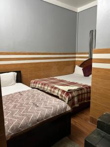 Postel nebo postele na pokoji v ubytování Hotel Quality