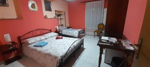 Postel nebo postele na pokoji v ubytování Le Vecchie Mura B & B + 8 fotografií