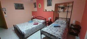 Postel nebo postele na pokoji v ubytování Le Vecchie Mura B & B