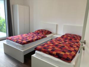 Letto o letti in una camera di Gästehaus Witteborg