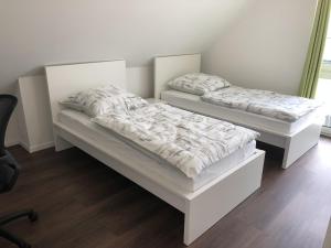 Letto o letti in una camera di Gästehaus Witteborg