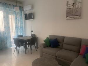 a living room with a couch and a table at Casa ELLI in Rimini