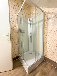 a shower with a glass door in a bathroom at Landhotel Engel & Kreuz in Gaggenau +108 photos
