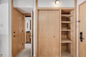 a room with a closet with wooden doors at Laurelwood Condominiums 414 in Snowmass Village