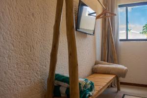 Μια τηλεόραση ή/και κέντρο ψυχαγωγίας στο Villas Manatee Apartamento H101 Nobile Stays