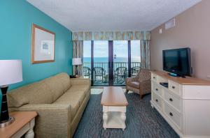 A seating area at The Strand - A Boutique Resort