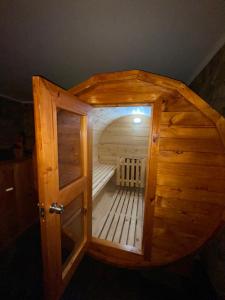 a small wooden sauna with a door in a room at Alojamiento RBOY Las Mariposas in Chillán +37 photos