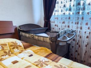 Ένα ή περισσότερα κρεβάτια σε δωμάτιο στο Rafto Apartment