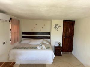 Postel nebo postele na pokoji v ubytování Hotelito Crismi