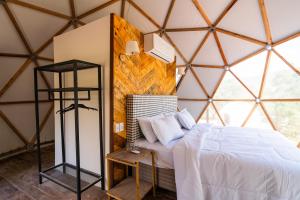 Katil atau katil-katil dalam bilik di Monakó Cabanas