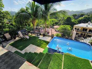 a view of a backyard with a swimming pool at Casa Rosa in Sayulita