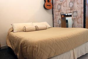 Una cama o camas en una habitación de Loft Mendoza Capital Musica y Fotografia