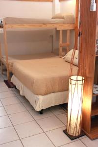 Una cama o camas en una habitación de Loft Mendoza Capital Musica y Fotografia