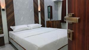 Voodi või voodid majutusasutuse ParNam Hotel toas