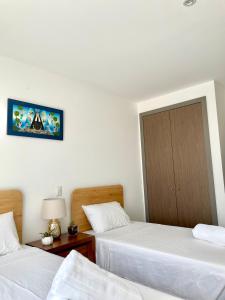 Postel nebo postele na pokoji v ubytování Skyline Suite in Polanco Best Location Fast Wifi