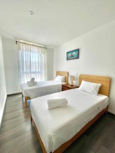 Postel nebo postele na pokoji v ubytování Skyline Suite in Polanco Best Location Fast Wifi