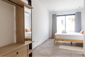 Postel nebo postele na pokoji v ubytování LXRY Villas
