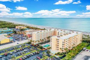 an aerial view of a hotel next to the beach at Sandcastles 2br2ba Cocoa Beach Ocean Views! in Cocoa Beach