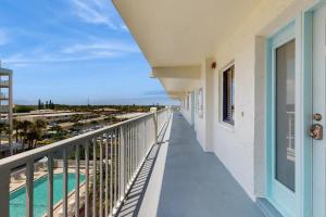 a balcony with a view of the beach at Sandcastles 2br2ba Cocoa Beach Ocean Views! in Cocoa Beach