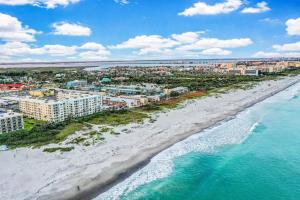 an aerial view of the beach and buildings at Sandcastles 2br2ba Cocoa Beach Ocean Views! in Cocoa Beach
