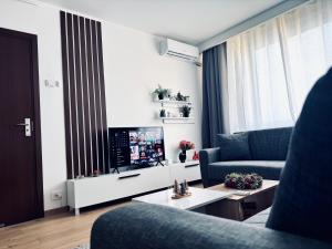 TV a/nebo společenská místnost v ubytování UNDE Home