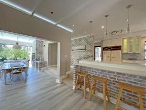 a kitchen and dining room with a table and chairs at House 41 at Pont de Val in Parys