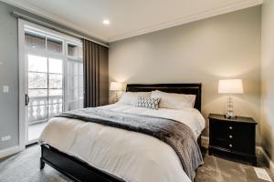 a bedroom with a large bed and a window at The Sono Chicago in Chicago