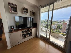 TV a/nebo společenská místnost v ubytování Lo de Mario al rio