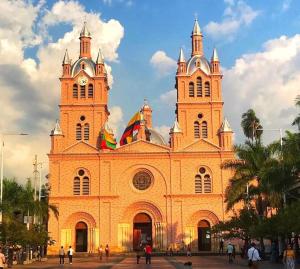 a large church with two towers on top of it at Hospedaje DJ in Buga