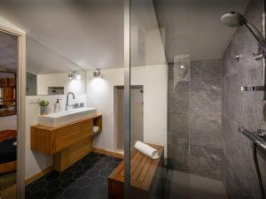 a bathroom with a sink and a shower at Chalet Paravis - OVO Network in La Clusaz +17 photos