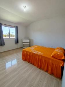 Ένα ή περισσότερα κρεβάτια σε δωμάτιο στο Studio Sonho Meu