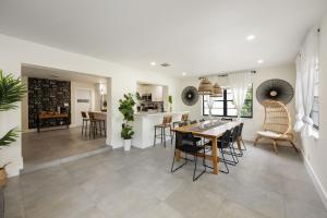 a kitchen and dining room with a table and chairs at Pompano Cove in Pompano Beach