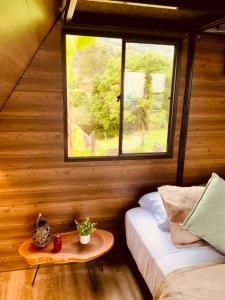 Ένα ή περισσότερα κρεβάτια σε δωμάτιο στο Cabaña Ecolodge Buenos Aires