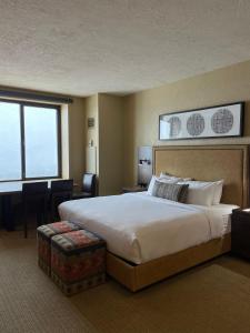 a hotel room with a large bed and a large window at The Grand Summit Hotel in the Canyons Village - Walk to Ski Lift - Pool, Gym, Spa, More! in Park City