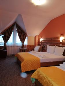 Postel nebo postele na pokoji v ubytování Boutique Guest House IKONOMOV + 37 fotografií