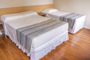 Cama o camas de una habitación en Hotel Nacional Inn Porto Alegre - Próximo ao Complexo Hospitalar Santa Casa e UFRGS