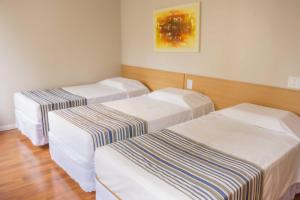 Cama o camas de una habitación en Hotel Nacional Inn Porto Alegre - Próximo ao Complexo Hospitalar Santa Casa e UFRGS
