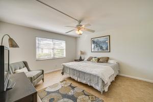 a bedroom with a bed and a ceiling fan at Lanai and Golf Course View Cozy Condo in Naples! in Naples +21 photos